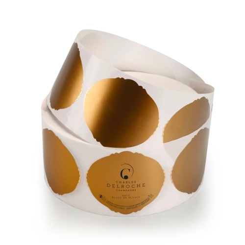 Rouleau d'étiquettes crantées sur fond or autocollantes